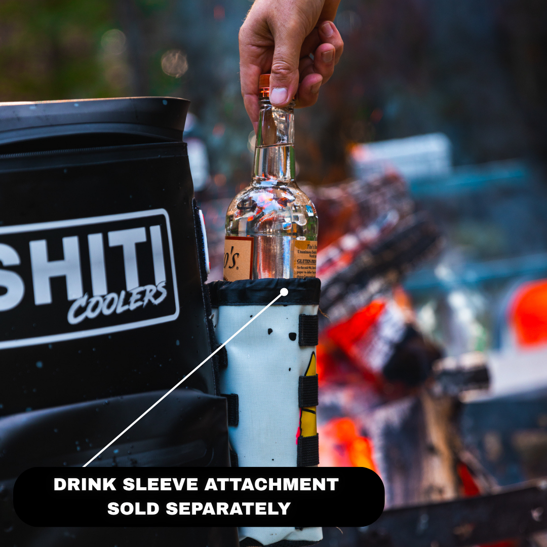 Blackout Backpack Cooler holding a bottle in a drink sleeve attachment, ideal for outdoor parties and gatherings.