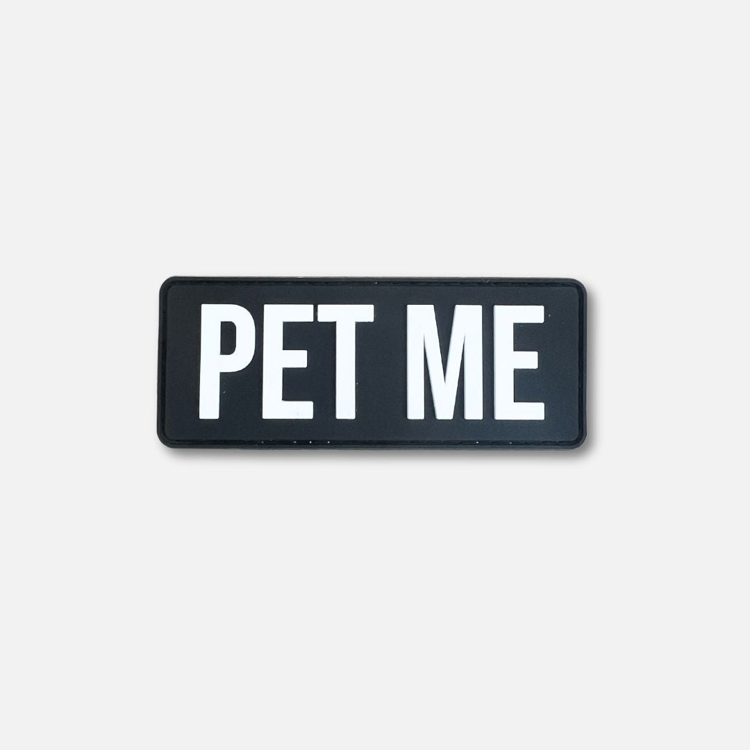 Black Velcro patch with bold white text reading "PET ME," designed for pet lovers and enthusiasts.