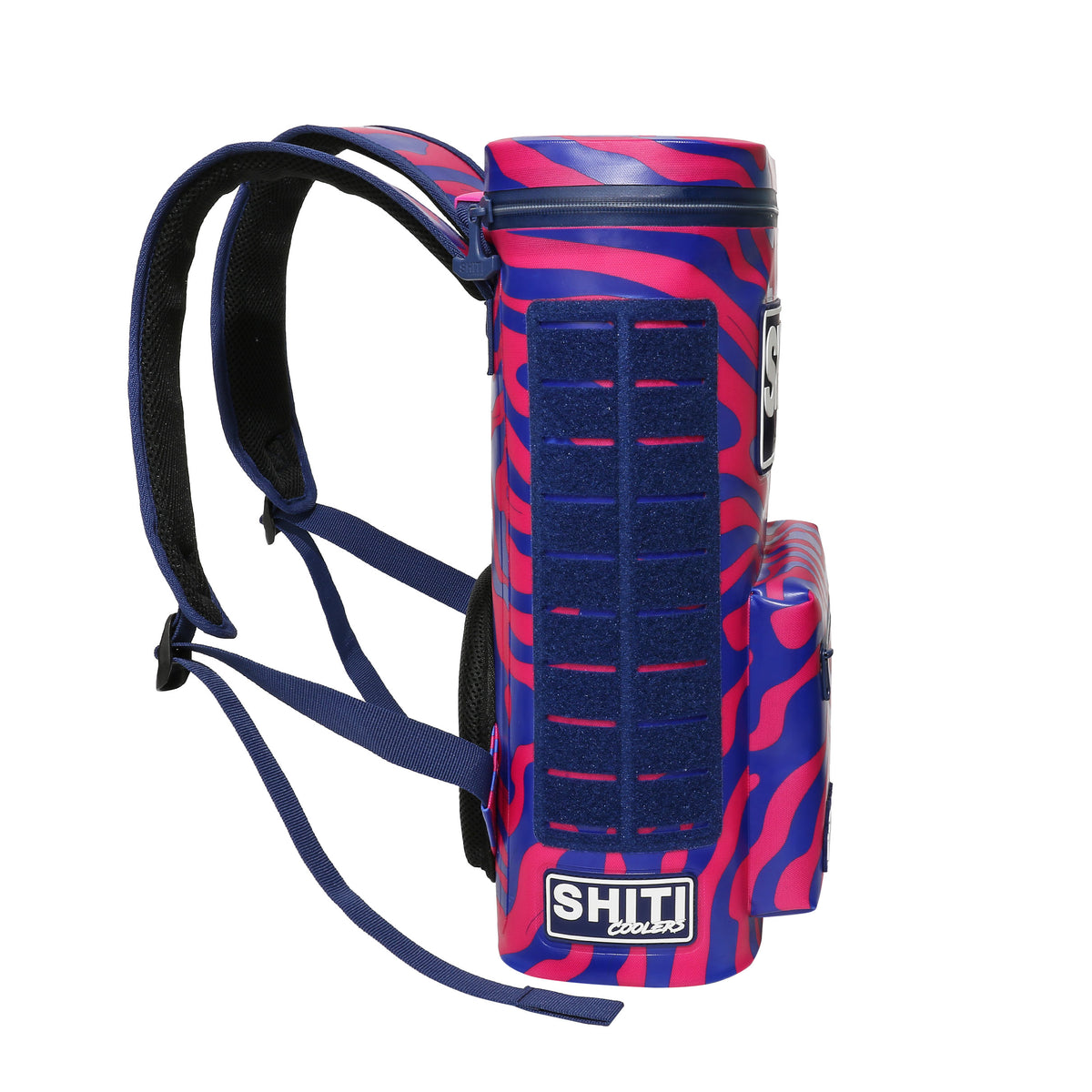 Side view of the Daytripper Backpack Cooler in vibrant pink and blue design, featuring adjustable straps and a spacious compartment for 15 cans.
