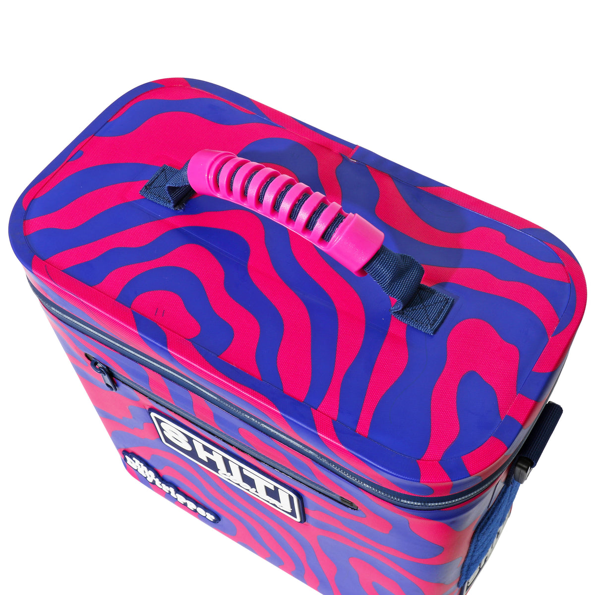 Top view of the Daytripper Soft Cooler featuring a vibrant pink and blue zebra pattern and a sturdy handle.