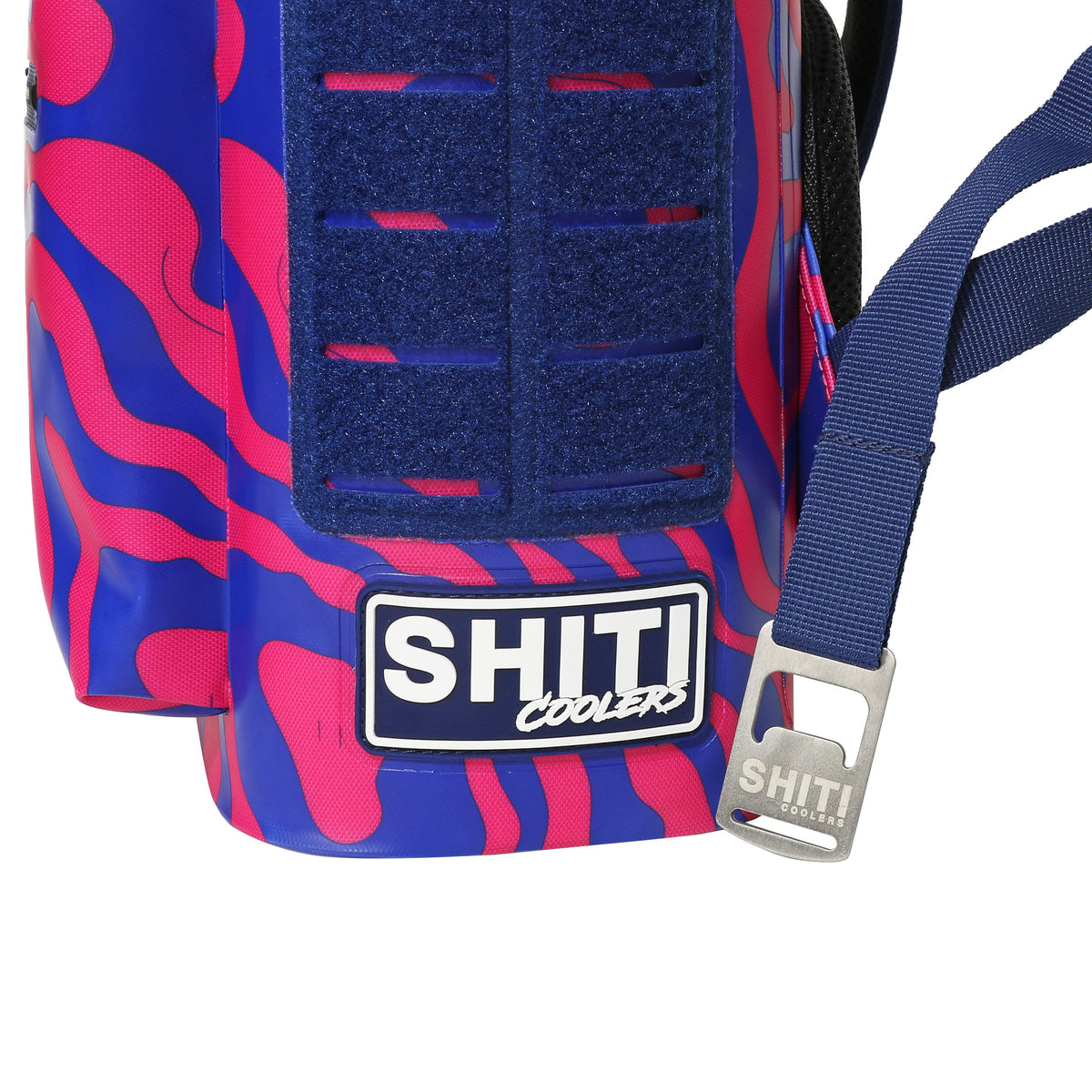 Vibrant Daytripper Backpack Cooler with pink and blue design, featuring a sturdy strap and SHITI Coolers logo.