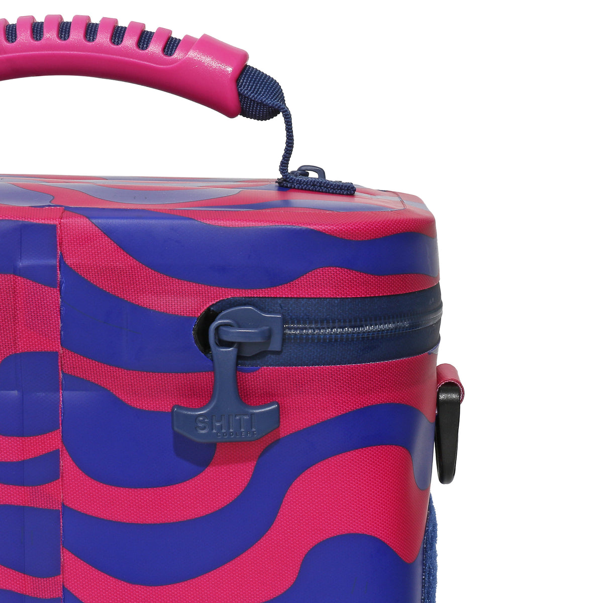 Close-up of the Daytripper Soft Cooler featuring a vibrant design, sturdy zipper, and comfortable handle for easy transport.