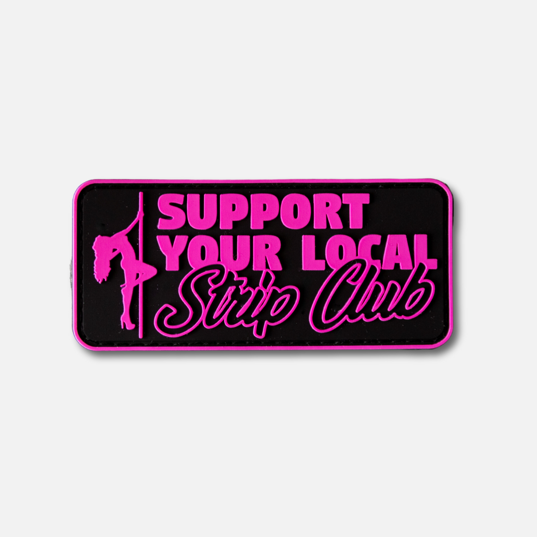 Velcro patch featuring bold pink text that reads "Support Your Local Strip Club" on a black background.