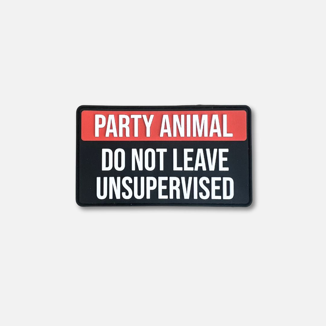 Black Velcro patch featuring bold text: "PARTY ANIMAL" in red and "DO NOT LEAVE UNSUPERVISED" in white.