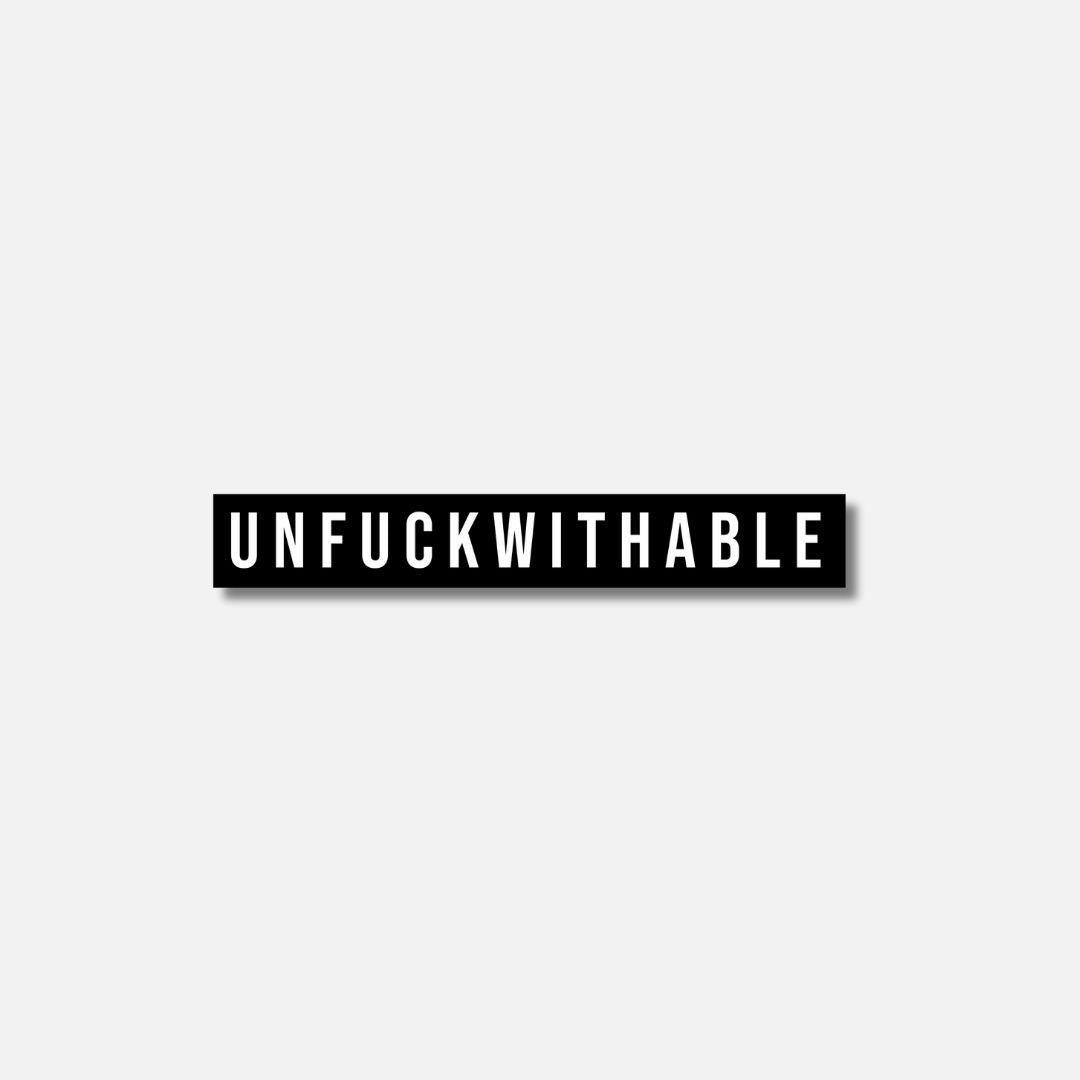 Black Velcro patch featuring the bold, white word &quot;UNFUCKWITHABLE&quot; in all capital letters.