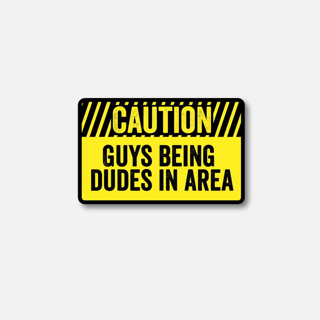 Caution Velcro patch with bold text stating &quot;Guys Being Dudes in Area&quot; on a bright yellow background.