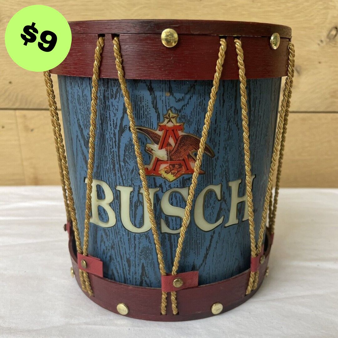 Used BUSCH drum lamp featuring a blue wooden design with a prominent logo, accented by red and gold detailing.
