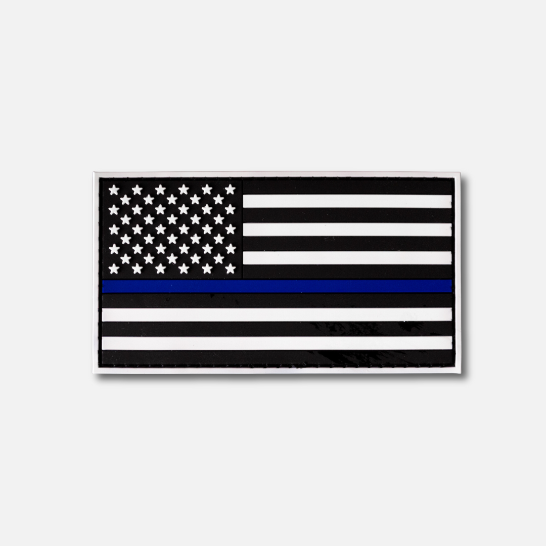 Blue Line Velcro patch featuring a black and white American flag with a blue stripe, symbolizing support for law enforcement.