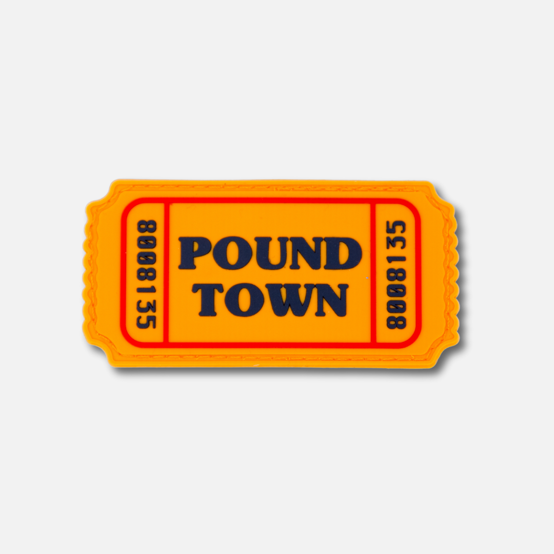 Bright orange Velcro patch featuring the text "POUND TOWN" in bold black letters, resembling a ticket design.