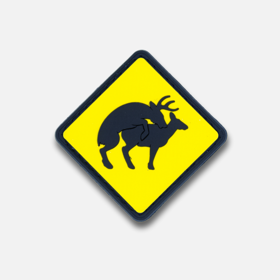 Yellow diamond-shaped Velcro patch featuring a black silhouette of a deer with a rider. Ideal for outdoor enthusiasts.