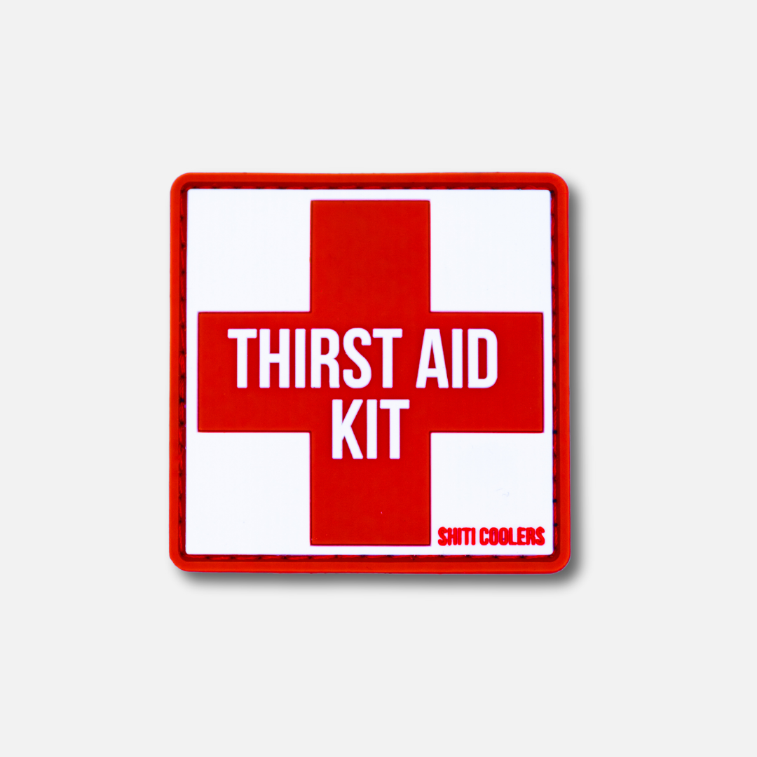 Red and white Velcro patch featuring the text "THIRST AID KIT" in bold letters, designed for SHITI Coolers.