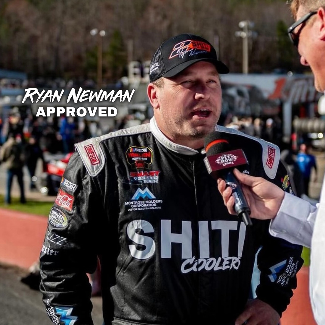 Fueler Backpack Cooler displayed with a NASCAR driver being interviewed, showcasing its sporty and functional design.
