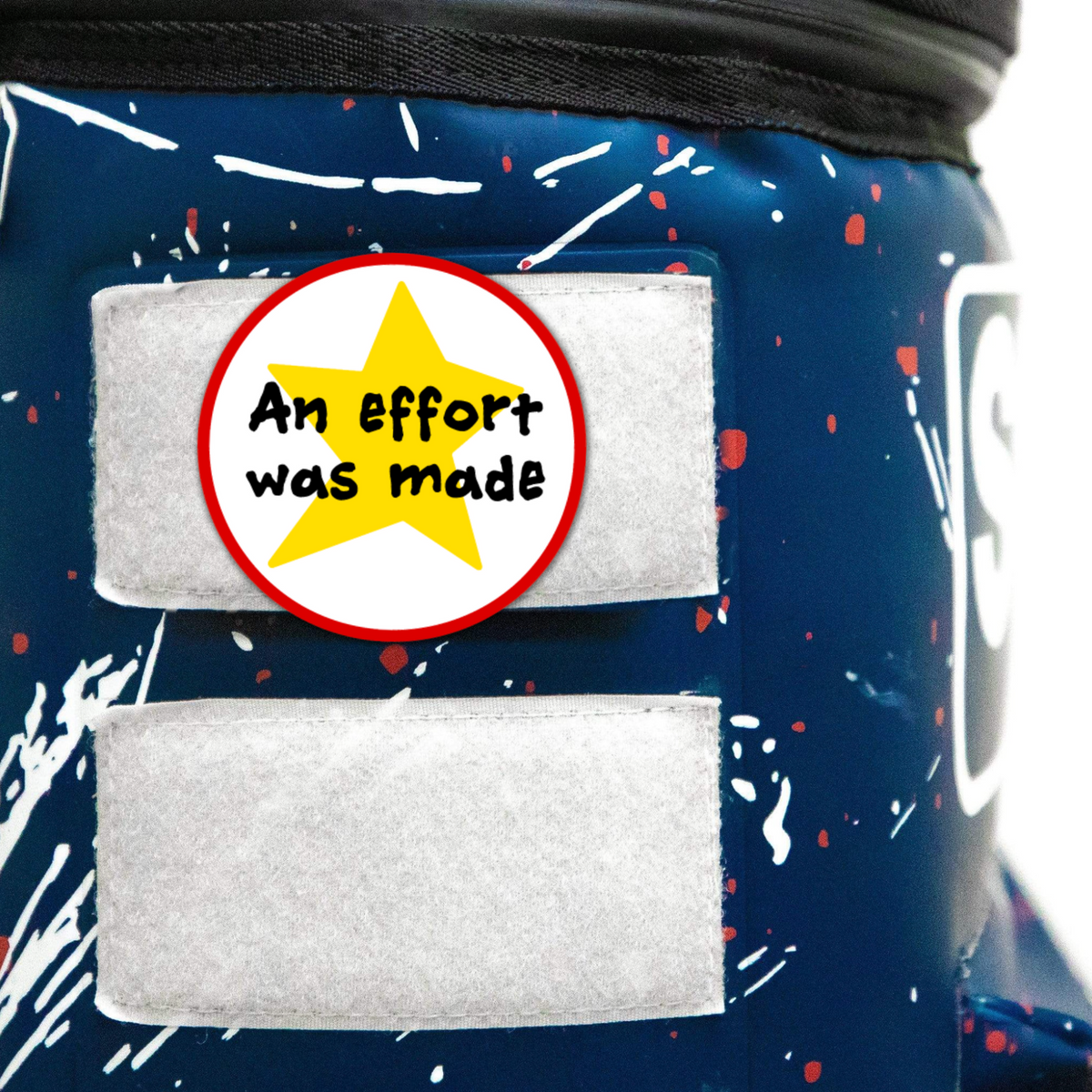 Velcro patch on a bag featuring the text &quot;An effort was made&quot; inside a star design, highlighting motivation and encouragement.