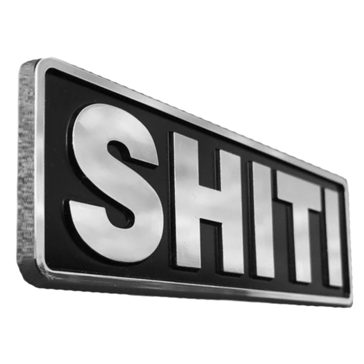 Chrome brand plate featuring bold, raised letters spelling "SHITI" on a black background, designed for customization.
